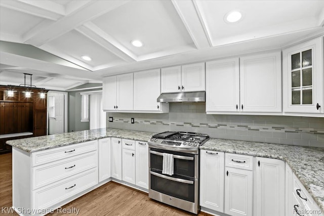 5152 Shenandoah Ct, West Bloomfield, MI 48323 - kitchen featuring range with two ovens, under cabinet range hood, a peninsula, light wood-style flooring, and white cabinetry