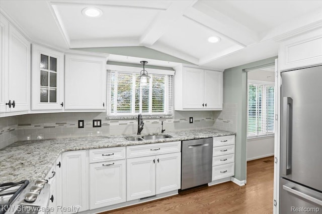5152 Shenandoah Ct, West Bloomfield, MI 48323 - kitchen featuring stainless steel appliances, wood finished floors, white cabinetry, backsplash, and recessed lighting