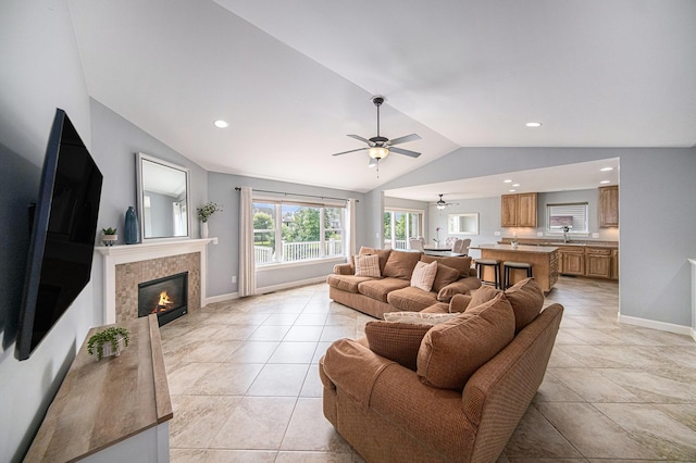 3544 Lexington Cir, Dexter, MI 48130 - living area with vaulted ceiling, ceiling fan, a tile fireplace, light tile patterned floors, and recessed lighting