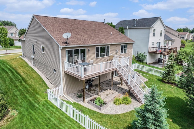 3544 Lexington Cir, Dexter, MI 48130 - rear view of house with a wooden deck, roof with shingles, stairs, and a fenced backyard