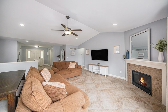 3544 Lexington Cir, Dexter, MI 48130 - living area featuring vaulted ceiling, ceiling fan, a tile fireplace, and recessed lighting