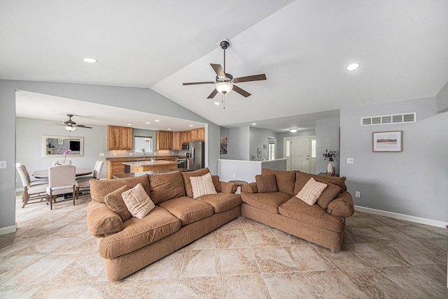 3544 Lexington Cir, Dexter, MI 48130 - living area featuring a ceiling fan, lofted ceiling, recessed lighting, and light stone finish flooring