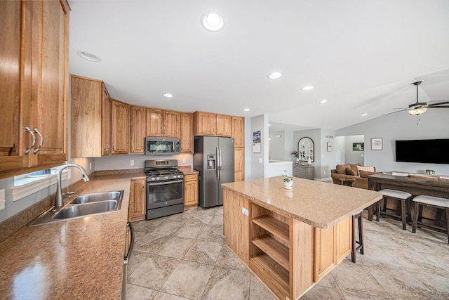 3544 Lexington Cir, Dexter, MI 48130 - kitchen with appliances with stainless steel finishes, a kitchen island, ceiling fan, vaulted ceiling, and recessed lighting