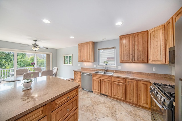 3544 Lexington Cir, Dexter, MI 48130 - kitchen featuring appliances with stainless steel finishes, healthy amount of natural light, ceiling fan, recessed lighting, and light countertops