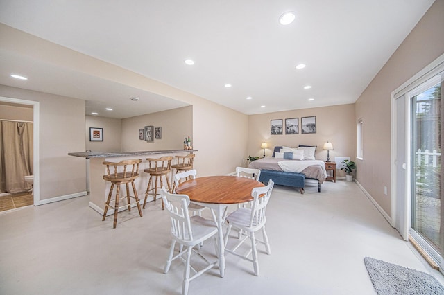 3544 Lexington Cir, Dexter, MI 48130 - dining space featuring a dry bar, recessed lighting, and light colored carpet