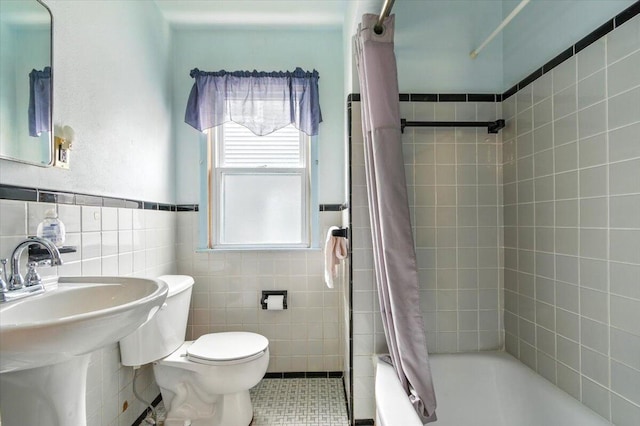 2251 Gardner Ave, Berkley, MI 48072 - full bath with tile walls, shower / bath combo, tile patterned floors, and a wainscoted wall