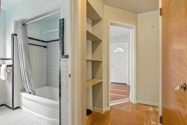 2251 Gardner Ave, Berkley, MI 48072 - full bathroom featuring shower / bathtub combination with curtain, wood finished floors, and built in shelves