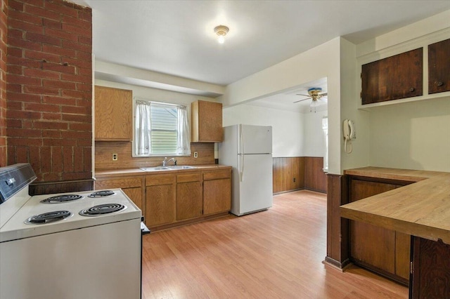 2251 Gardner Ave, Berkley, MI 48072 - kitchen with white appliances, a wainscoted wall, light wood finished floors, a ceiling fan, and light countertops
