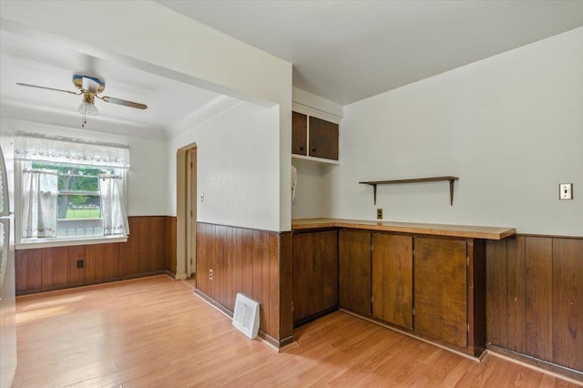 2251 Gardner Ave, Berkley, MI 48072 - unfurnished room featuring a wainscoted wall, light wood-type flooring, wood walls, and a ceiling fan