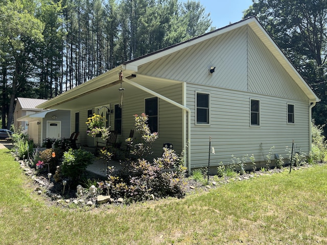 2564 Bialik Rd, Manistee, MI 49660 - view of property exterior with a yard