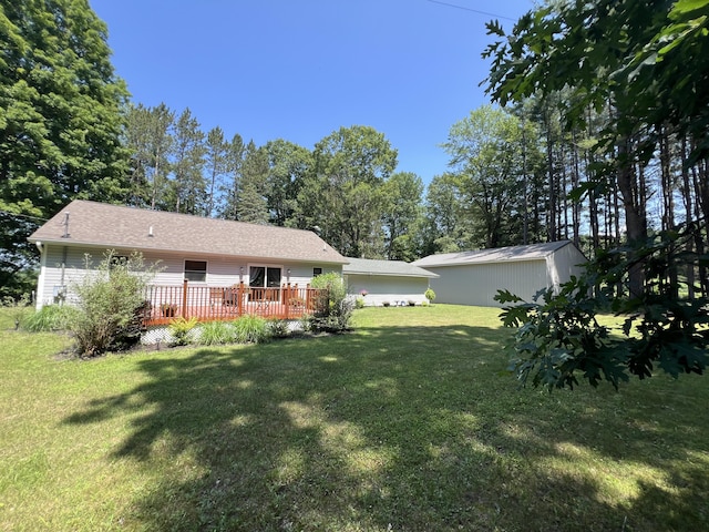 2564 Bialik Rd, Manistee, MI 49660 - view of grassy yard featuring a deck