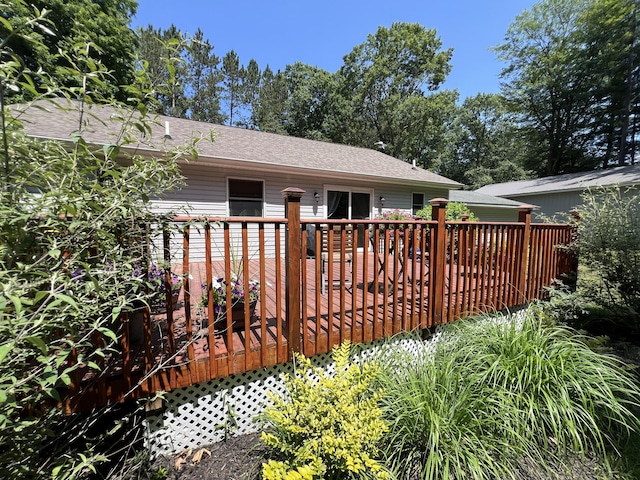 2564 Bialik Rd, Manistee, MI 49660 - back of house with a wooden deck and a shingled roof
