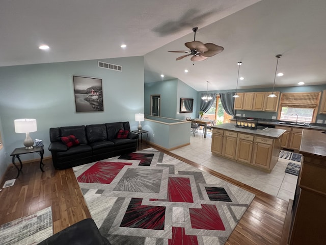 2564 Bialik Rd, Manistee, MI 49660 - living room with vaulted ceiling, ceiling fan, light wood-style floors, and recessed lighting