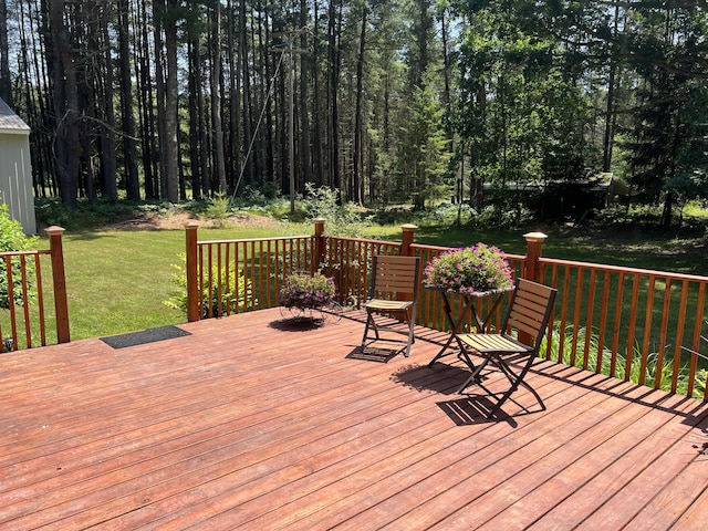 2564 Bialik Rd, Manistee, MI 49660 - deck featuring a lawn