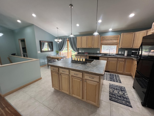 2564 Bialik Rd, Manistee, MI 49660 - kitchen with freestanding refrigerator, lofted ceiling, a chandelier, stainless steel microwave, and a center island