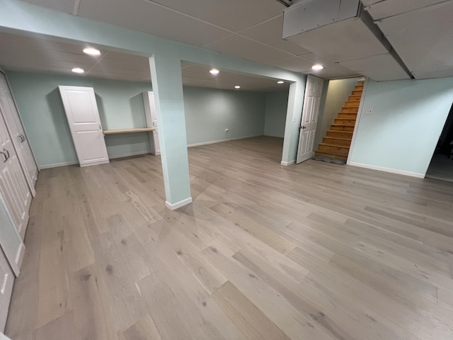 2564 Bialik Rd, Manistee, MI 49660 - finished below grade area featuring stairway, light wood finished floors, and recessed lighting