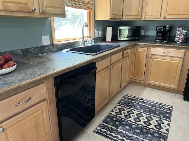 2564 Bialik Rd, Manistee, MI 49660 - kitchen with black dishwasher, stainless steel microwave, light brown cabinetry, and light tile patterned floors