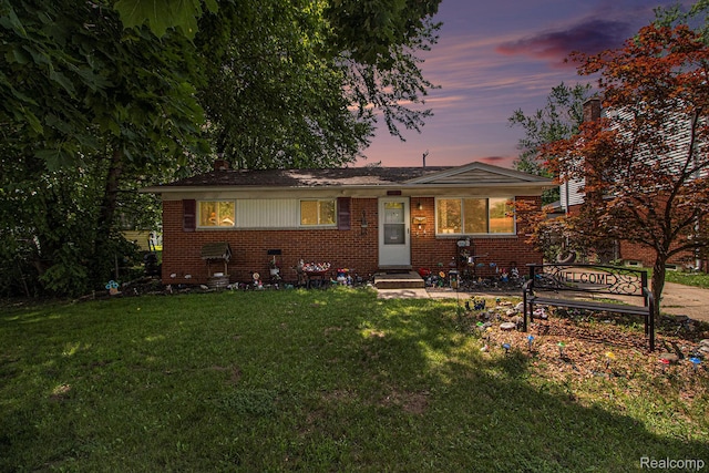 34919 Glover, Wayne, MI 48184 - bungalow-style home featuring brick siding, a lawn, and entry steps