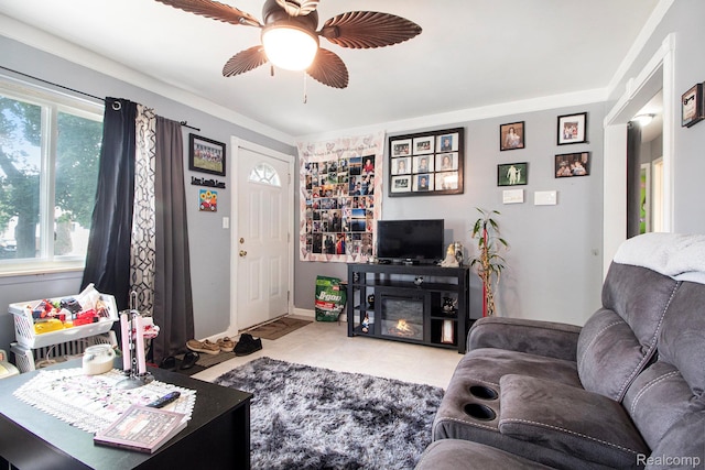 34919 Glover, Wayne, MI 48184 - living area with ceiling fan, ornamental molding, a glass covered fireplace, and tile patterned flooring