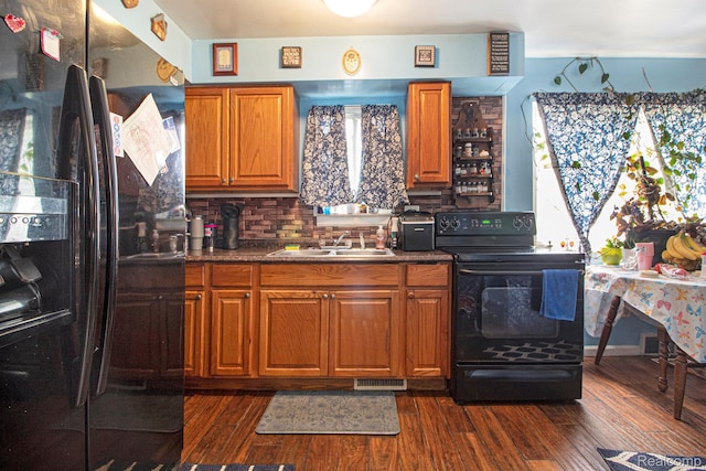 34919 Glover, Wayne, MI 48184 - kitchen with black appliances, dark wood-style floors, decorative backsplash, and brown cabinets