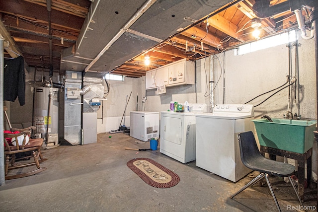 34919 Glover, Wayne, MI 48184 - below grade area featuring water heater, washer and clothes dryer, and heating unit