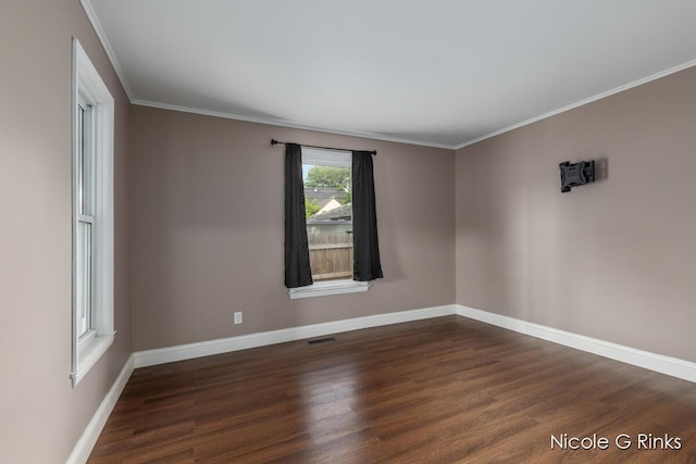 911 Baldwin St SE, Grand Rapids, MI 49506 - unfurnished room with dark wood-style floors and ornamental molding