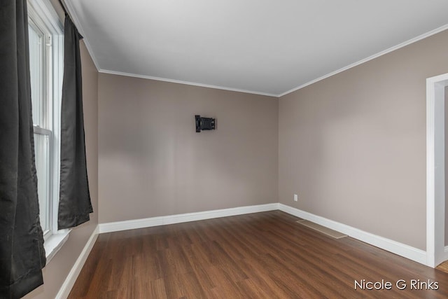 911 Baldwin St SE, Grand Rapids, MI 49506 - spare room with dark wood finished floors and ornamental molding