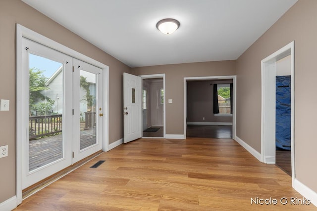 911 Baldwin St SE, Grand Rapids, MI 49506 - foyer entrance featuring light wood-style floors and baseboards