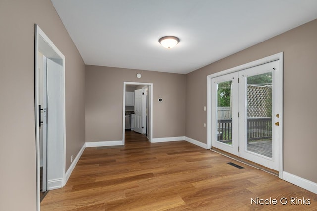911 Baldwin St SE, Grand Rapids, MI 49506 - unfurnished room featuring light wood-type flooring and baseboards