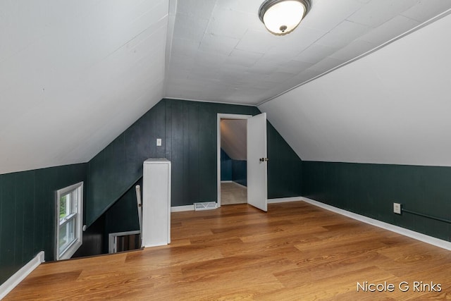 911 Baldwin St SE, Grand Rapids, MI 49506 - additional living space with lofted ceiling and wood finished floors