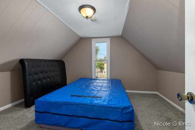 911 Baldwin St SE, Grand Rapids, MI 49506 - carpeted bedroom featuring lofted ceiling and baseboards