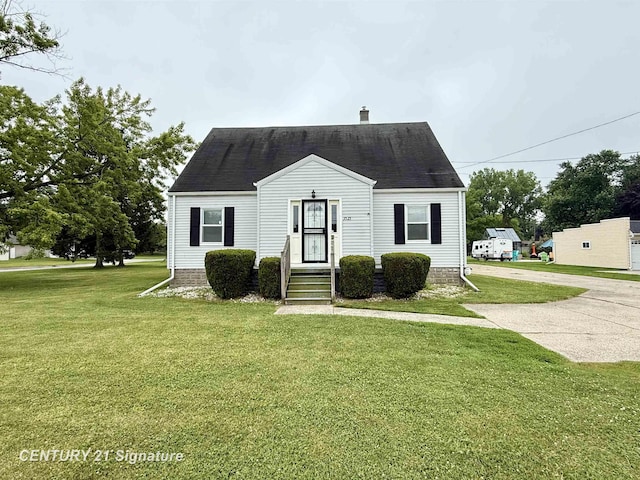 3525 Shattuck Rd, Saginaw, MI 48603 - cape cod-style house featuring a front lawn and a chimney