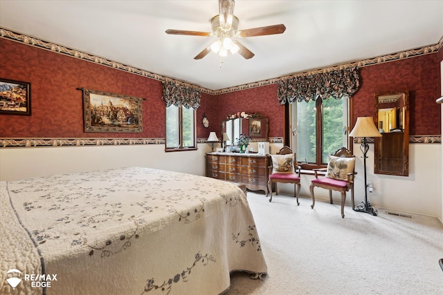 11206 E Atherton Rd, Davison, MI 48423 - bedroom featuring wallpapered walls, carpet, multiple windows, and ceiling fan