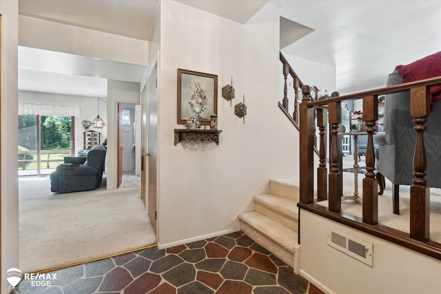11206 E Atherton Rd, Davison, MI 48423 - staircase with carpet floors and baseboards
