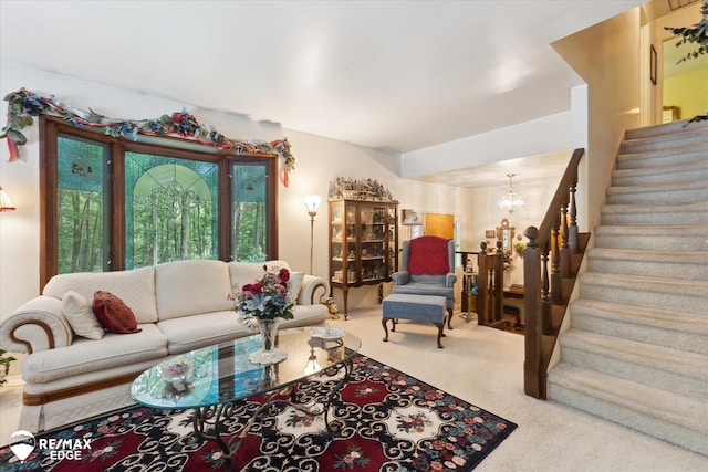 11206 E Atherton Rd, Davison, MI 48423 - carpeted living room with stairs and a chandelier