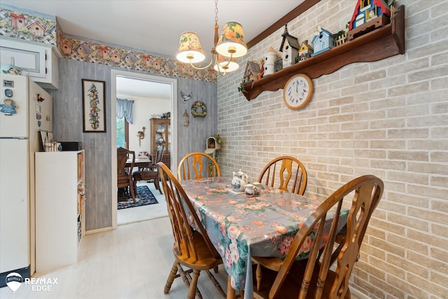11206 E Atherton Rd, Davison, MI 48423 - dining space with a chandelier and light wood finished floors