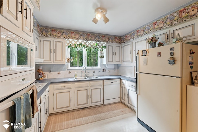 11206 E Atherton Rd, Davison, MI 48423 - kitchen featuring white appliances and decorative backsplash
