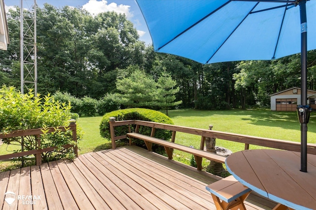 11206 E Atherton Rd, Davison, MI 48423 - wooden terrace with a lawn, an outbuilding, and view of wooded area