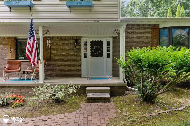 11206 E Atherton Rd, Davison, MI 48423 - entrance to property with a porch and brick siding