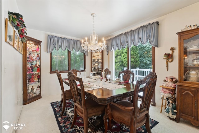 11206 E Atherton Rd, Davison, MI 48423 - dining area featuring a chandelier and light carpet