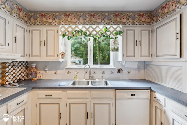 11206 E Atherton Rd, Davison, MI 48423 - kitchen with white dishwasher, decorative backsplash, under cabinet range hood, and cream cabinets
