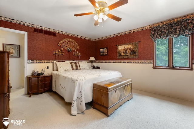 11206 E Atherton Rd, Davison, MI 48423 - bedroom with light carpet, wallpapered walls, and a ceiling fan