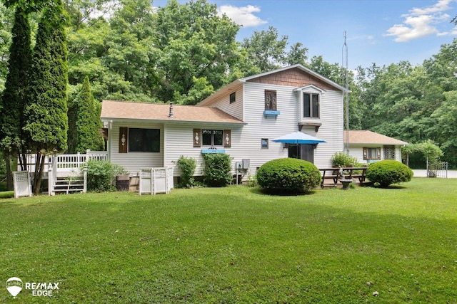 11206 E Atherton Rd, Davison, MI 48423 - rear view of house with a lawn, a wooden deck, and a shingled roof