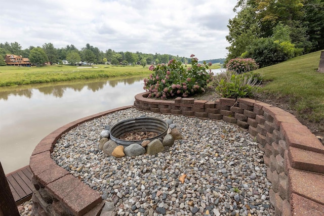 5370 N Lake Sanford Rd, Sanford, MI 48657 - view of yard featuring a water view and an outdoor fire pit