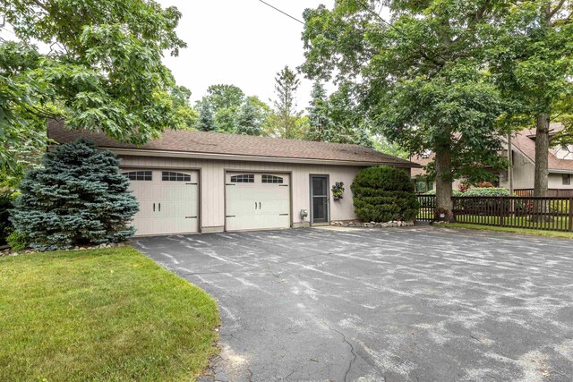 5370 N Lake Sanford Rd, Sanford, MI 48657 - garage featuring driveway