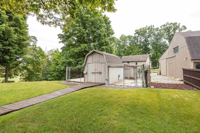5370 N Lake Sanford Rd, Sanford, MI 48657 - view of yard featuring a storage shed and a gate