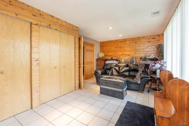 5370 N Lake Sanford Rd, Sanford, MI 48657 - living room with wood walls, light tile patterned floors, and recessed lighting