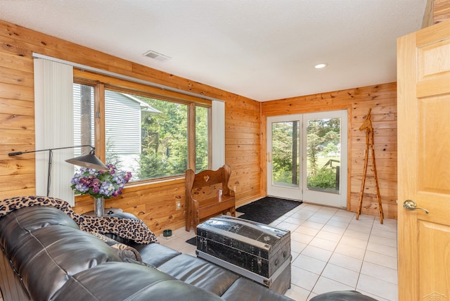 5370 N Lake Sanford Rd, Sanford, MI 48657 - living area featuring light tile patterned floors, wooden walls, and recessed lighting