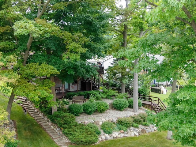 5370 N Lake Sanford Rd, Sanford, MI 48657 - view of grassy yard with stairs and a wooden deck