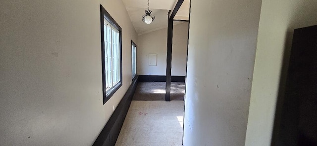 4997 S Croton Hardy Dr, Newaygo, MI 49337 - hallway featuring plenty of natural light, vaulted ceiling, and light floors